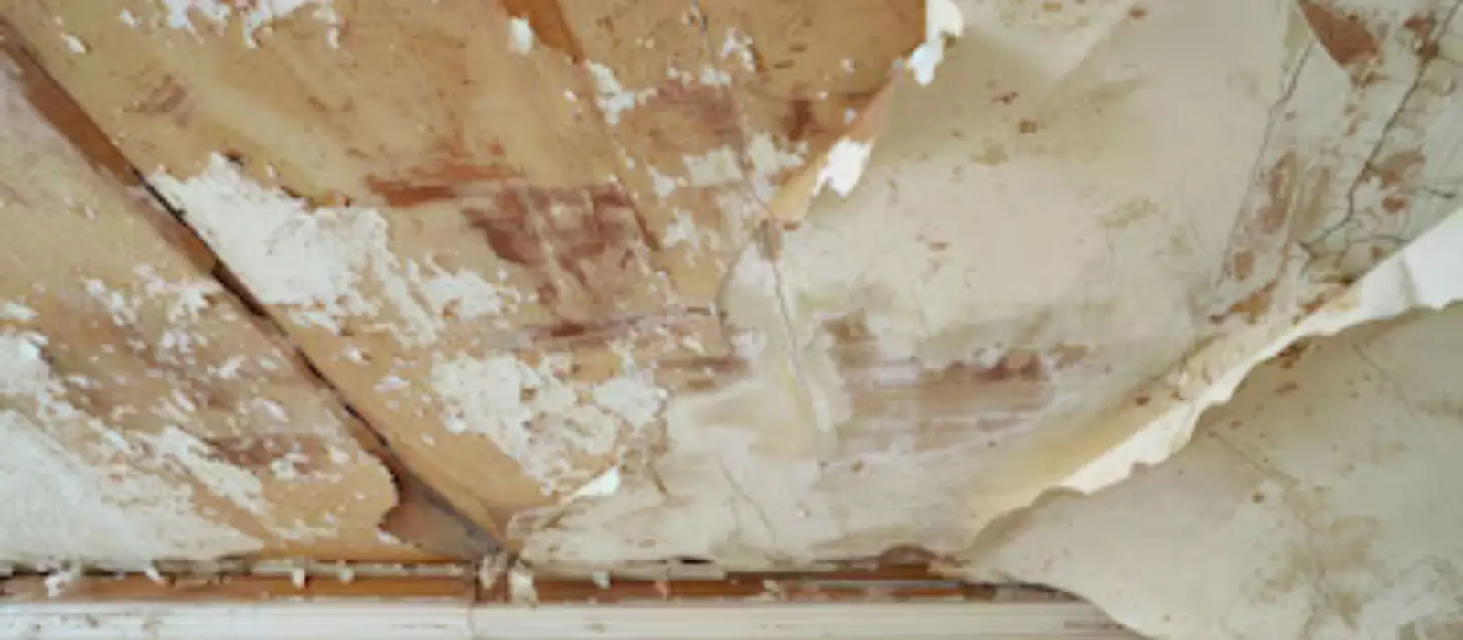 Water-stained ceiling with peeling paint